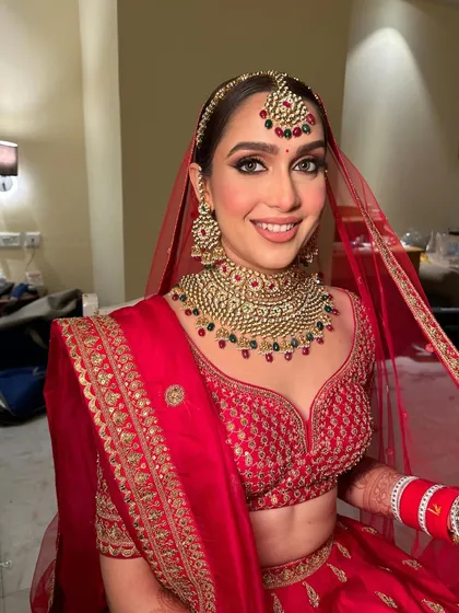 The bride's happy and radiant expression says it all. The makeup is designed to make her feel confident and beautiful on her special day.