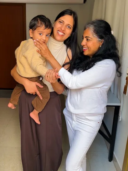 A candid moment with a mother and her one-year-old. It's a joy to see my little clients grow.