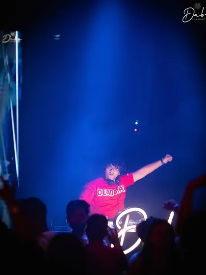 A shot from my electrifying performance at Dabo Club. The blue lights and high energy made for an unforgettable night.