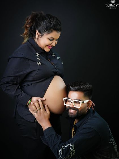 A playful and happy moment where the father-to-be listens to the baby bump. His unique style and joyful expression make this a truly personal and fun photograph.