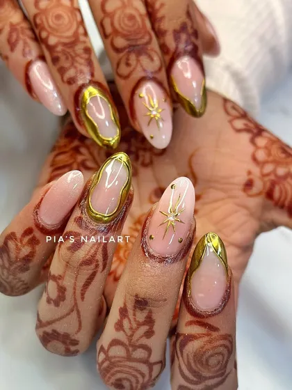 A close-up of the stunning 3D gold chrome bridal nails, showing the texture and shine that makes this design so popular.