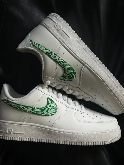 A top-down view of the green paisley swoosh custom sneakers.