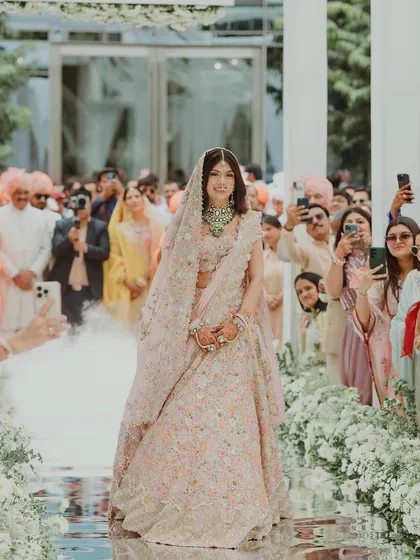 Tanisha’s grand bridal entry. Her soft, glowing makeup was visible even from a distance, making her look like a vision as she walked down the aisle.