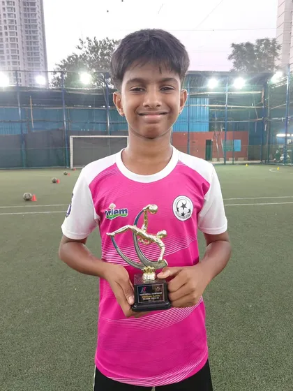 Celebrating our individual award winners. Deon Shetty holds his trophy for Best Goalkeeper, a testament to his hard work and talent.