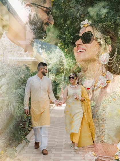 A romantic double-exposure portrait of the couple walking hand-in-hand. The artistic layering of images creates a soft, dreamlike quality.