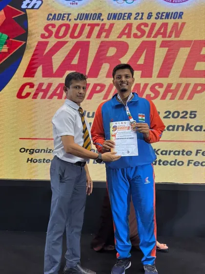 A proud moment for the academy. Our student Jitendra Kumar stands with his Gold Medal at the 9th South Asian Karate Championship in Colombo, Sri Lanka, after winning the +84kg U21 category.