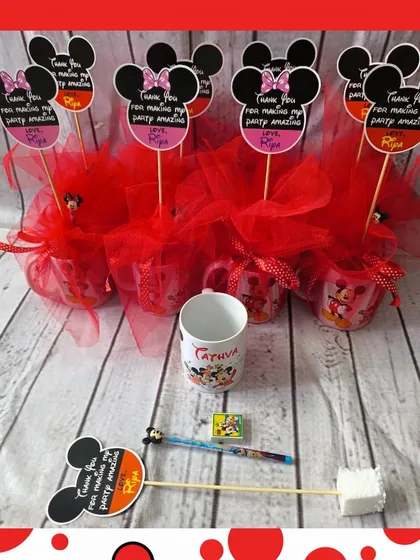 This Mickey Mouse mug hamper is a classic choice. It includes a character mug, a matching pencil and eraser, and is beautifully wrapped in red netting with a custom tag.