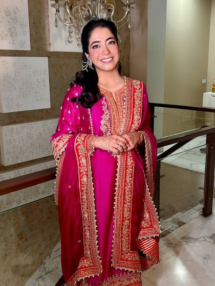 A full-length view of Tanisha's gorgeous Roka outfit and her glowing makeup.