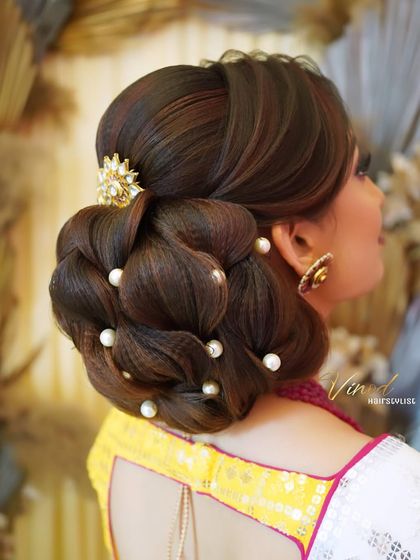 The final leaf-element bun, a creative and elegant updo perfect for a bride who wants something unique.