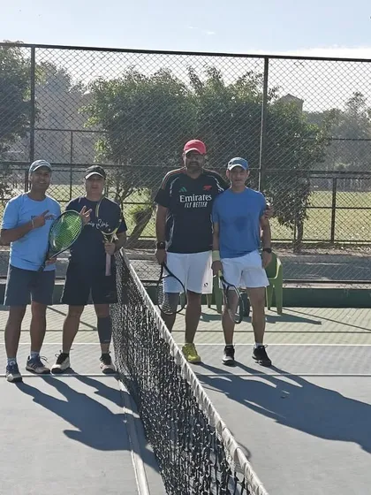 Players posing on the court at Modern School after a great day of tennis. Our events are held at top-quality facilities to provide the best experience.