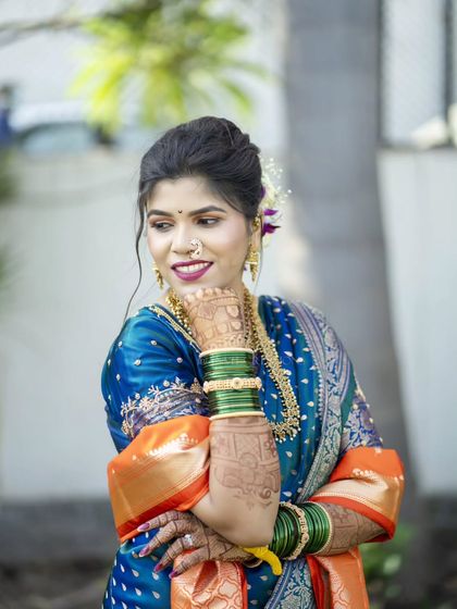 A playful and coy bridal portrait, capturing a moment of happy contemplation.