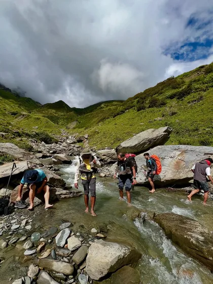 A chilly river crossing on the Friendship Peak trek. It's all part of the adventure.
