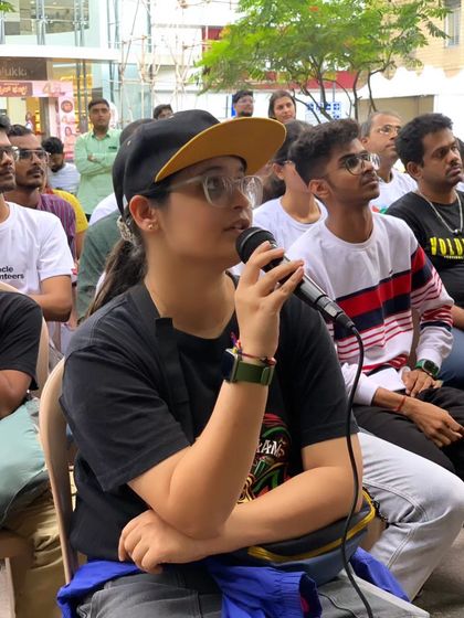 A participant asks a question during a Q&A session at Sign Fest. We encourage open dialogue and curiosity to foster greater understanding and allyship.