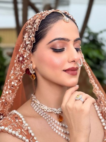 Eyes closed, the focus is entirely on the beautiful eyeshadow work and the radiant glow on her skin. This is my signature soft glam, perfect for the modern bride.