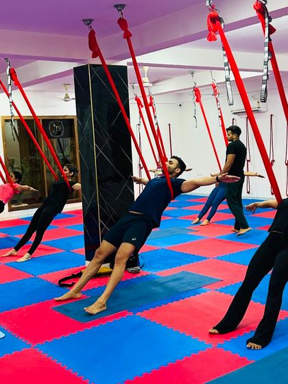 A synchronized reverse plank line shows the collective strength and focus of our class. Students work together to hold this challenging core-strengthening pose.