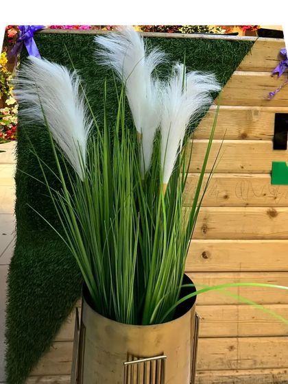 We offer trendy options like this artificial pampas grass in a sleek planter. It's perfect for adding a soft, bohemian touch to a room without worrying about the fragility and shedding of dried natural pampas.