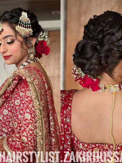 A textured bridal updo with interwoven braids and curls, decorated with red roses and baby's breath. This style is perfect for a bride who wants a romantic yet intricate look.