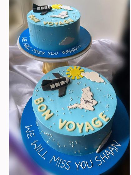 Two "Bon Voyage" cakes for two friends embarking on a new journey together. It was special to create a matching set for their farewell.