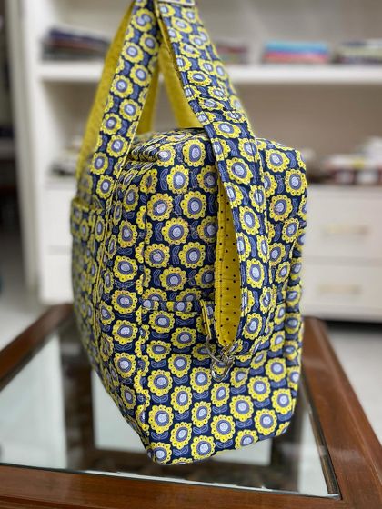 A profile view of the travel bag, showing the depth and structure that makes it so practical.