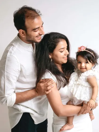 A slightly different angle of this beautiful family, showing their loving interaction.