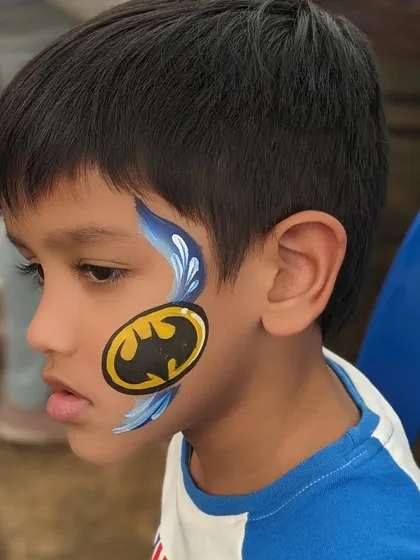 The Batman symbol with a blue splash effect, a cool and graphic design for young superhero fans.
