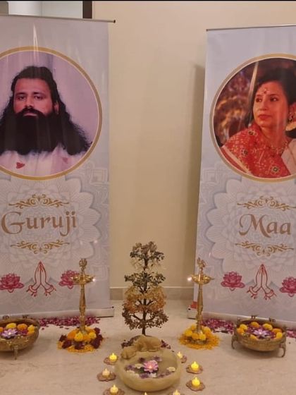 A decorative setup for our Chakra Meditation Program, with banners of Guruji and Maa. This image highlights the reverence and sacredness with which we conduct our spiritual events.