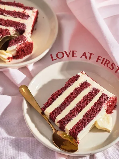 Love at first bite. A perfect slice of my Red Velvet cake, revealing its moist, vibrant layers and the thick, creamy frosting that balances its flavor.