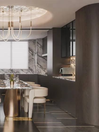 A dining area in a luxury penthouse, featuring a marble table with a sculptural brass base and a unique, rippling light fixture in the ceiling cove.