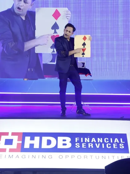 Performing a card prediction for the audience at the HDB Financial Services IPO party. Even a simple card trick can become a powerful moment of mentalism when performed on a corporate stage.