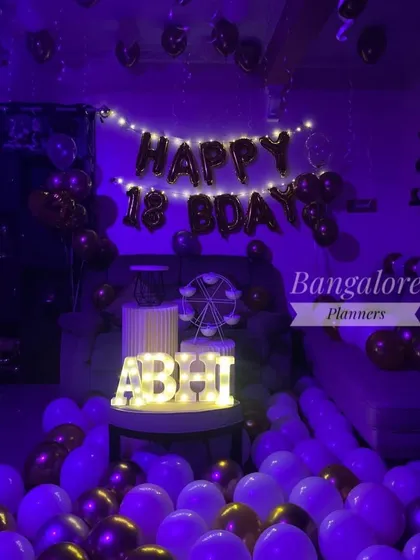 The same 18th birthday room decor, shown here under a cool purple light, creating a completely different party vibe.