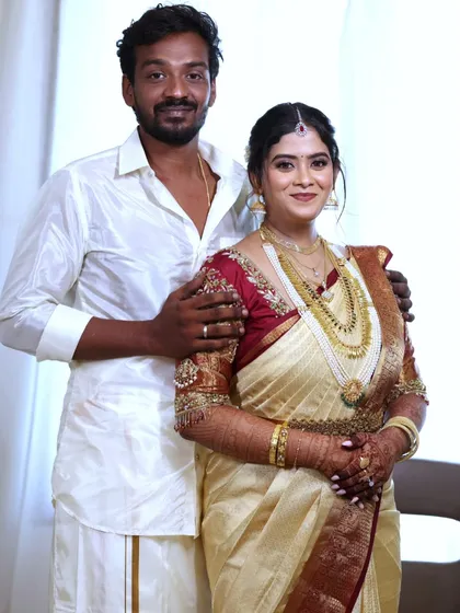 A lovely portrait of the bride and groom. Her traditional attire is perfectly complemented by a makeup look that is both elegant and timeless.