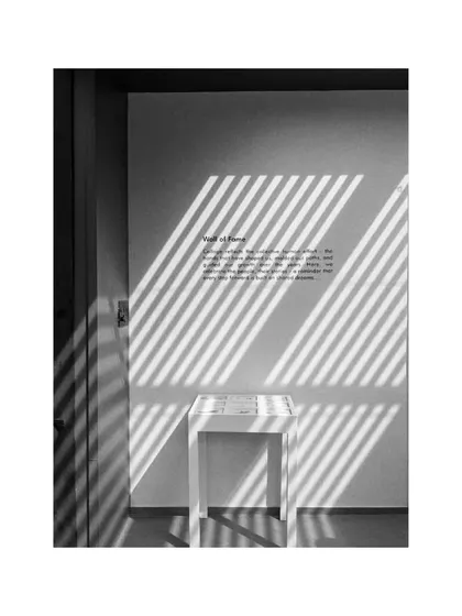 Light and shadow become integral parts of the decor in our studio. The strong lines cast from the window animate the wall, interacting with the text and furniture.