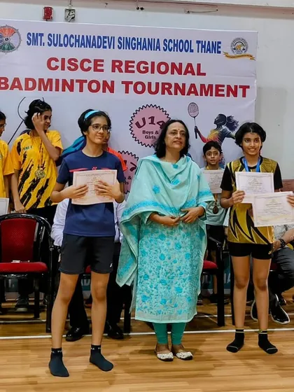 Our champions on the podium. Khanak Jhalani and other winners at the CISCE regional badminton tournament, proudly holding their certificates of achievement.