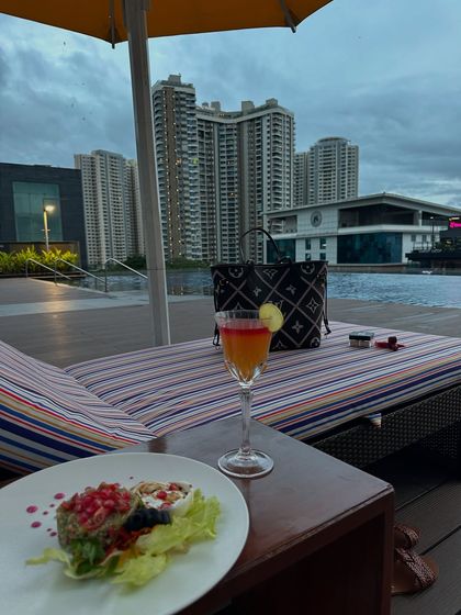 Golden hour and blue water, a mood I never want to leave. A shot from my staycation at the Sheraton Bangalore, enjoying the poolside view.