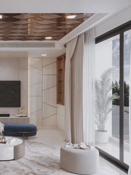 This shot focuses on the interplay of light and texture on the marble floor and the geometric TV wall.