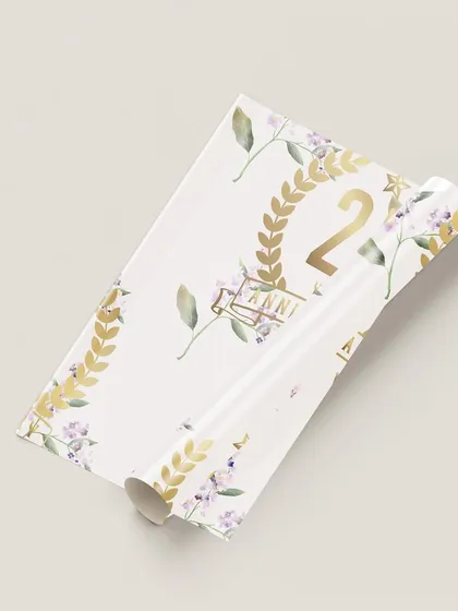 The beauty of a cohesive visual story is in the details. I designed this custom gift wrap for a 25th anniversary, using a delicate lilac and gold theme to ensure even the smallest elements of the celebration felt personal and luxurious.