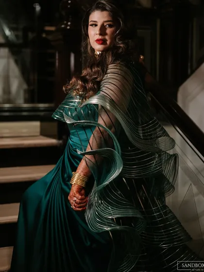 A series of portraits showcasing the bride's elegant and modern reception look, highlighting the details of her designer saree.