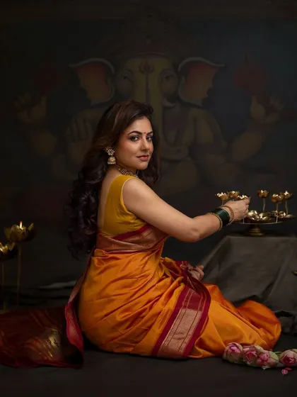 This festive shoot was for a talented makeup artist who wanted to celebrate her favorite time of year. The warm diyas and traditional saree create a beautiful portrait filled with the joy of Ganesh Chaturthi.