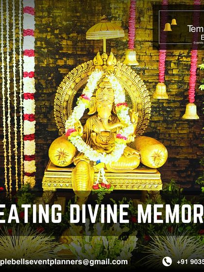 Creating divine memories with this beautiful idol setup, surrounded by flowers and traditional bells, embodying the spirit of our name, Temple Bells.