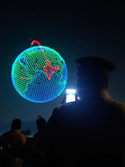 A police officer watches our record-breaking formation of the planet Earth with India highlighted. Our shows are a moment of pride for every Indian.