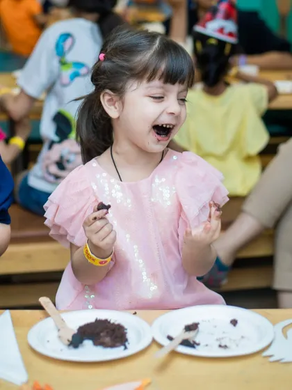 That look of pure delight says it all. Our chocolate cake is a certified hit with the Lil' Cubs.