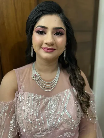 A full view of the party hairstyle, showing the height at the crown and the soft curls. This style is designed to be both beautiful and comfortable.