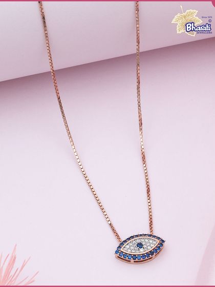 Delicate in design, powerful in purpose. This evil eye chain is crafted in rose gold and adorned with blue and white diamonds, designed to protect your energy with refined style.