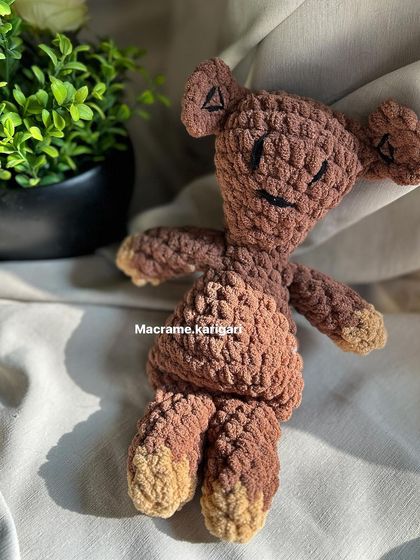 A different angle of our crochet Teddy, showing its simple, charming construction. It's a toy that brings back fond memories.