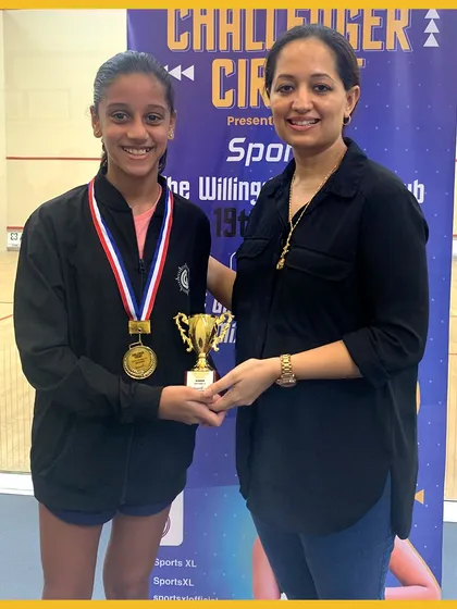 A young champion receives her trophy, marking a successful run in the Challenger Circuit 2023.