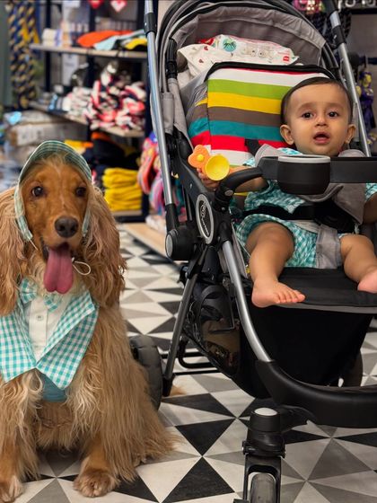 Our two boys twinning in their matching outfits during a shopping trip. Posto is always ready to pose for the camera.