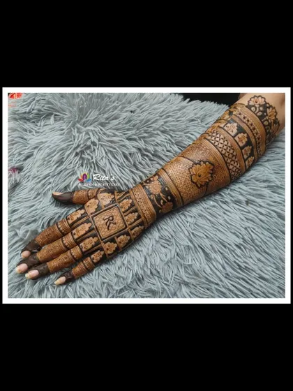 The full arm and hand design, showcasing a beautiful blend of traditional and geometric styles.