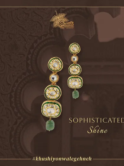 Make a statement with our exquisite long earrings, handcrafted with Kundan and Meenakari. The design is further adorned with shimmering pearls, diamonds, and a lustrous Moti stone for a sophisticated shine.