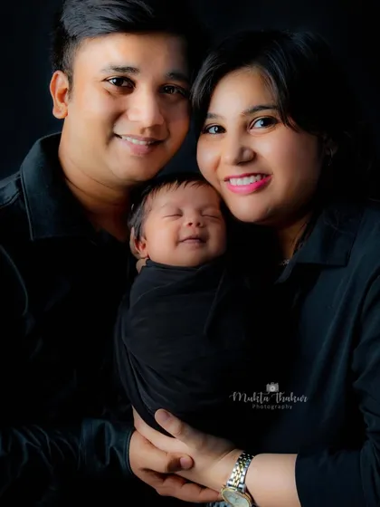 A perfect first family portrait. The smiles on their faces say it all. This newborn is so loved.