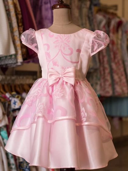 Another promotional image for my sale, showcasing this elegant pink party dress. I love making my designs accessible to more families during sale events.